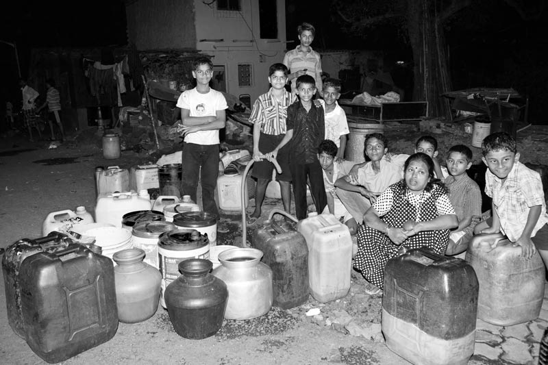 Urban Drinking Water Challenges - Waiting for water late in the night at a group connection in Mumbai, Maharashtra